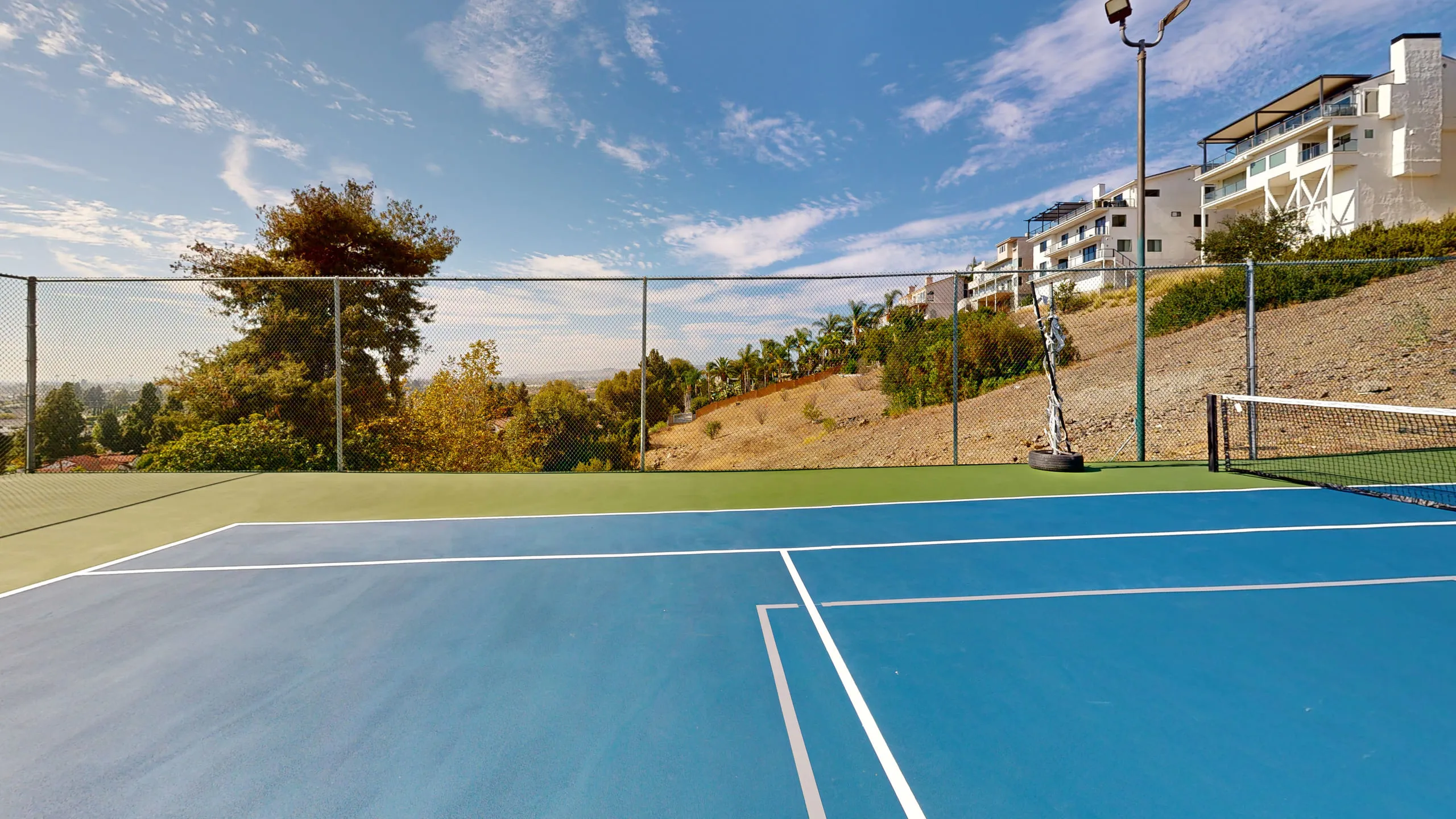 The court with the hills beyond