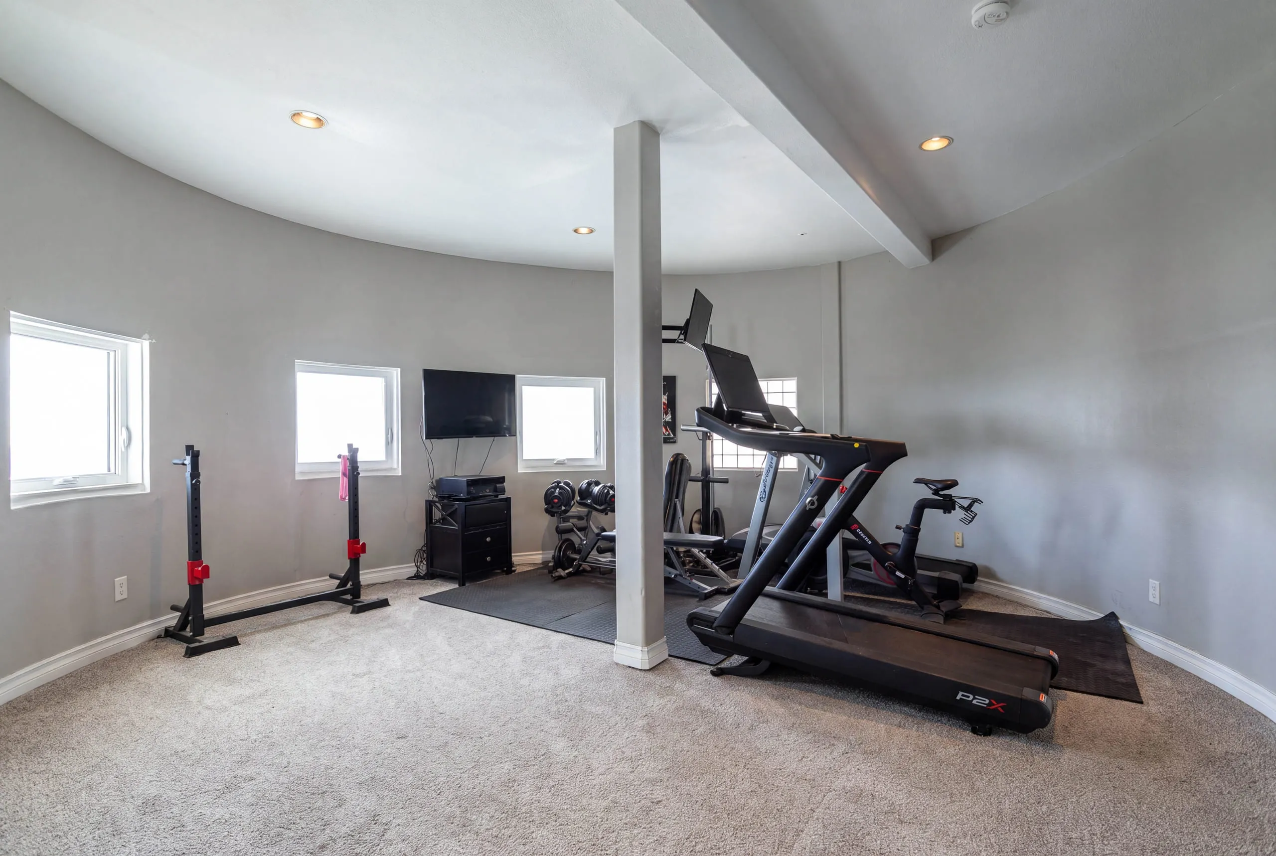 Home gym in the curved tower room