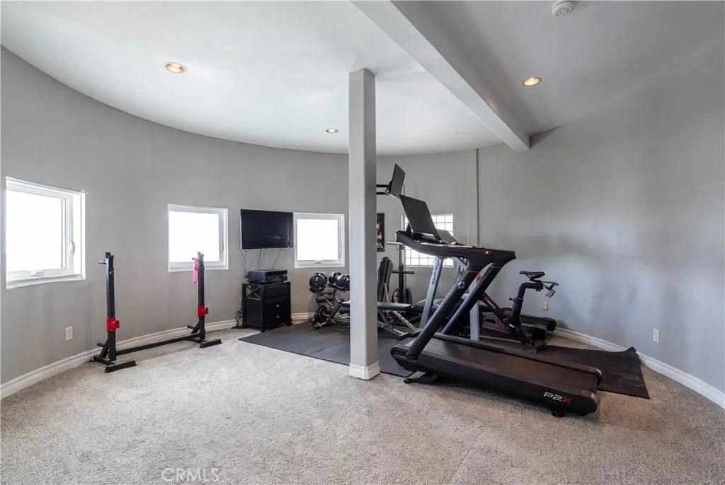 Home gym in the curved tower room